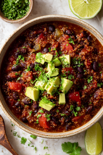 Comforting Quinoa and Black Bean Chili with spices, loaded with nutrition, perfect for festive gatherings and cold days.