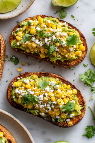 A delicious Mexican Street Corn Avocado Toast topped with zesty corn, creamy avocado, and cilantro, perfect for gatherings or light dinners.
