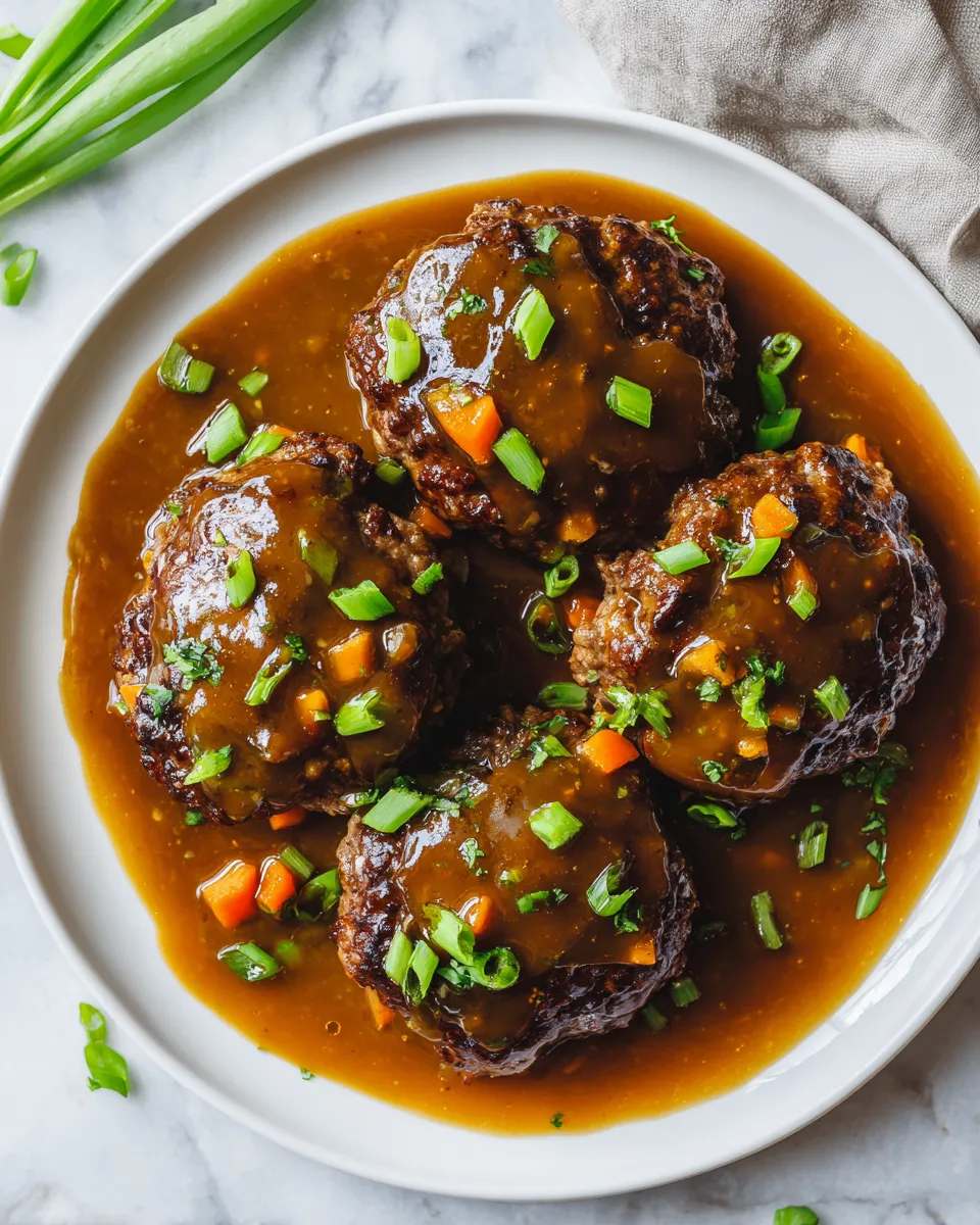 Hawaiian Hamburger Steaks served with rich gravy, quick comfort food, ideal for gatherings, and with savory flavors.