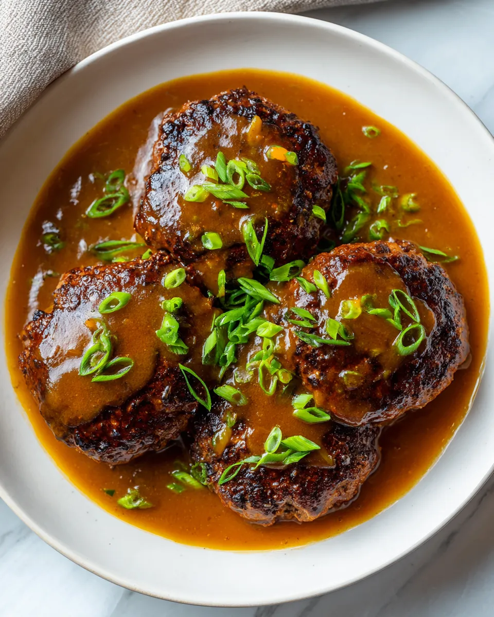 Hawaiian Hamburger Steaks served with rich gravy, quick comfort food, ideal for gatherings, and with savory flavors.