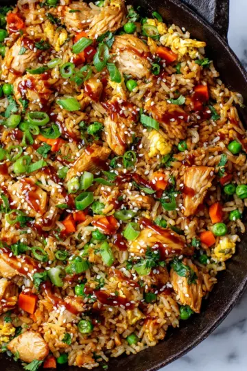 Chinese Chicken Fried Rice with vegetables and eggs, a quick stir-fry recipe for family dinners, using day-old rice for the best texture.