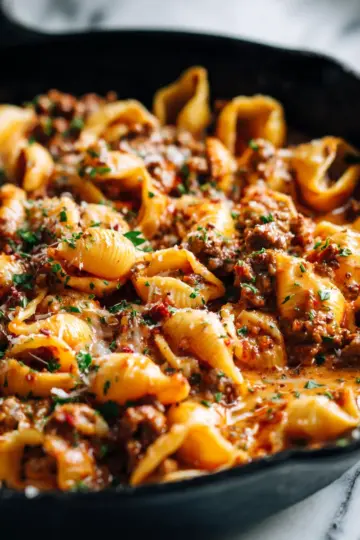 One-Pot Creamy Beef and Shells dish, a comforting pasta recipe perfect for fall gatherings. Quick and easy comfort food for busy weeknights.